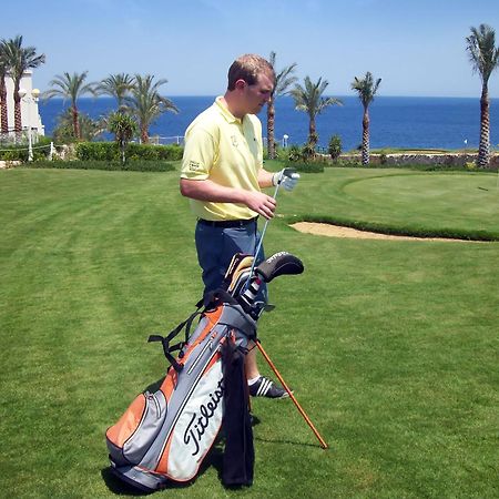 Stella Di Mare Beach Hotel & Spa Sharm el-Sheikh Exterior photo Golf player with a golf bag